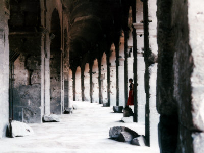 Woman Standing In Archway Of The Coliseum, Rome, Italy by Ilona Wellmann Pricing Limited Edition Print image