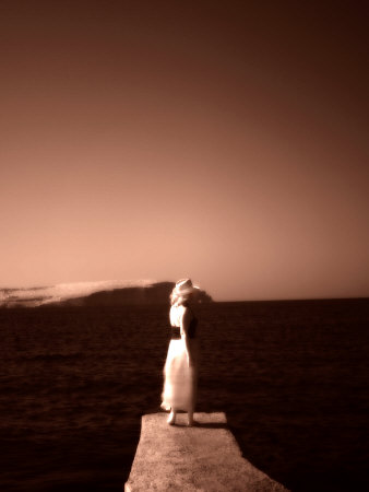 Lone Woman Standing On Jetty, Malta, Orange Toned by Ilona Wellmann Pricing Limited Edition Print image