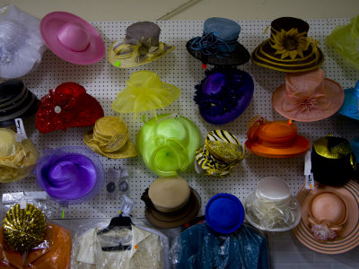 Rainbow Selection Of Used Ladies Hats At A Church Bazaar by Stephen St. John Pricing Limited Edition Print image