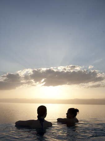 Two Friends Enjoy The Sunset Over The Dead Sea From A Hot Tub by Taylor S. Kennedy Pricing Limited Edition Print image