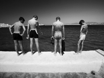 Boys Looking Over Edge Of Pier Into Water by Scott Stulberg Pricing Limited Edition Print image