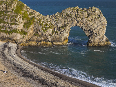 People Sitting On The Beach Beside Durdle Door Natural Rock Arch, Dorset, England, United Kingdom by Adam Burton Pricing Limited Edition Print image