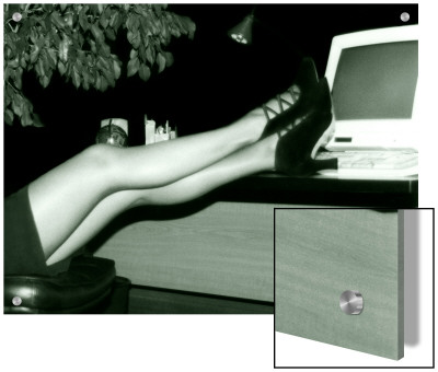 Womans Crossed Legs Propped Up On Office Desk With Computer by I.W. Pricing Limited Edition Print image