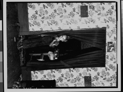 Little Boy Standing In Curtained Doorway And Holding Toy Pistol; He Is Son Of Miner, Clabe Hicks by Russell Lee Pricing Limited Edition Print image