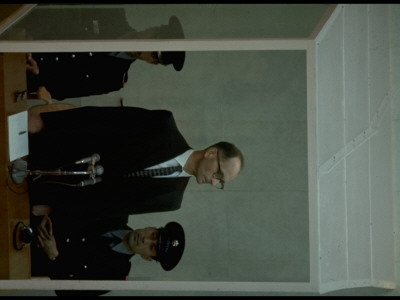 Nazi Adolf Eichmann In Prisoner's Cage During Reading Of Indictment At His Trial For War Crimes by Gjon Mili Pricing Limited Edition Print image