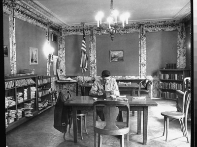 Young Man Reading Book At Table In Book Canteen In The New York Public Library by Alfred Eisenstaedt Pricing Limited Edition Print image
