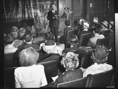Author Clifford Laube Reading To Audience In The New York Public Library by Alfred Eisenstaedt Pricing Limited Edition Print image
