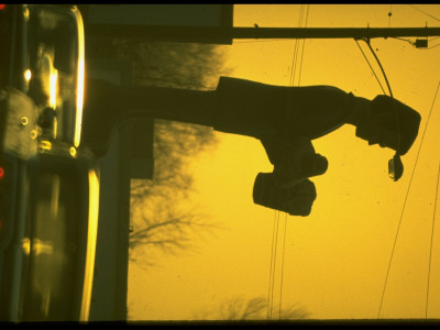 Advertising Sign Looming Over Heavy Traffic, Hazardous Distraction by Ralph Crane Pricing Limited Edition Print image