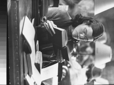 Young Woman Reading Book In The New York Public Library by Alfred Eisenstaedt Pricing Limited Edition Print image