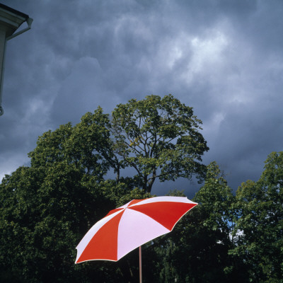 Broken Sunshade Beneath Cloudy Sky by Bengt-Goran Carlsson Pricing Limited Edition Print image