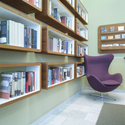 Liebeskind Publishers Bookshop, Munich Germany, Chair By Shelves In Corner Of Room by James Balston Pricing Limited Edition Print image