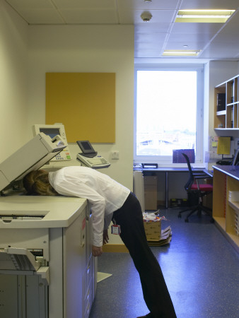 Office Life And Interiors Part Two, Woman Asleep On A Photocopier by Tim Mitchell Pricing Limited Edition Print image