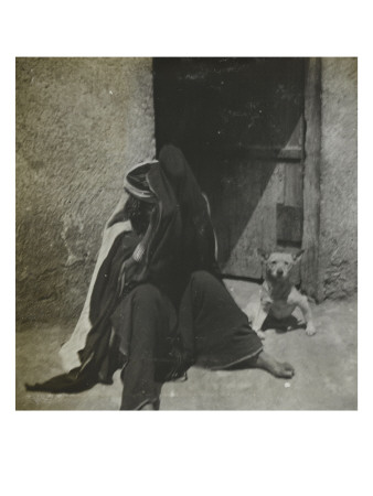 Un Homme Assis Et Un Chien Devant Une Maison À Biskra by Henri Jacques Edouard Evenepoel Pricing Limited Edition Print image