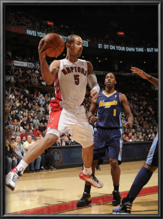 Denver Nuggets V Toronto Raptors: Nene And Jerryd Bayless by Ron Turenne Pricing Limited Edition Print image