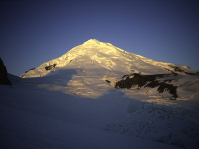 Sun On Illiamna Volcano In Alaska, Usa by Michael Brown Pricing Limited Edition Print image