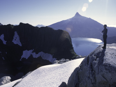 A Climber Enjoying The View Over The Mountain Landscape, Chile by Pablo Sandor Pricing Limited Edition Print image