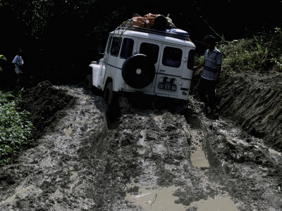 Stuck In The Mud, Indonesia by Michael Brown Pricing Limited Edition Print image