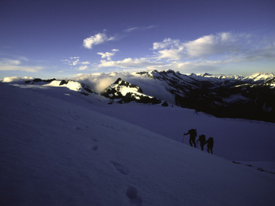 Climbers Follow Footsteps In The Snow, New Zealand by Michael Brown Pricing Limited Edition Print image