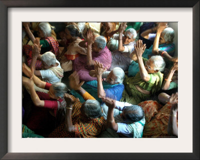 Abandoned Elderly Women Raise Hands During A Prayer Meeting by M. Lakshman Pricing Limited Edition Print image