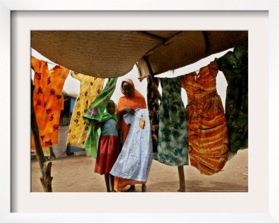 A Sudanese Woman Buys A Dress For Her Daughter At The Zamzam Refugee Camp by Nasser Nasser Pricing Limited Edition Print image