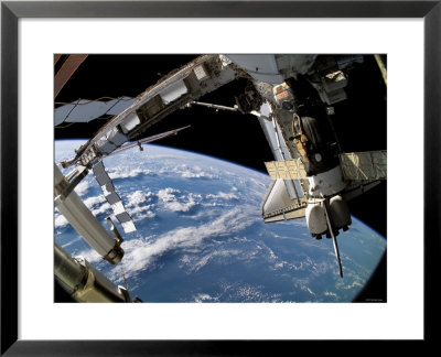 The Docked Space Shuttle Atlantis (Sts-115) And A Soyuz Spacecraft by Stocktrek Images Pricing Limited Edition Print image