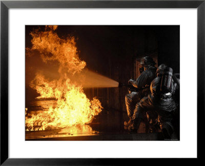 Firefighters Extinguishing A Simulated Battery Fire by Stocktrek Images Pricing Limited Edition Print image