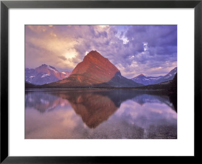 Sunrise On Swiftcurrent Lake In Many Glacier Valley, Glacier National Park, Montana, Usa by Chuck Haney Pricing Limited Edition Print image