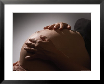Pregnant Woman Strokes Her Baby Through Her Belly by Paul Damien Pricing Limited Edition Print image