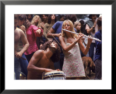 Shirtless Male Drummer And Dress Wearing Female Flutist Jamming During Woodstock Music Festival by Bill Eppridge Pricing Limited Edition Print image