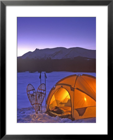 Winter Camping With Snowshoes, East Glacier, Montana, Usa by Chuck Haney Pricing Limited Edition Print image