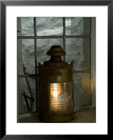 Old Anchor Light In The Window Of Historic Lighthouse, Stonington, Connecticut by Todd Gipstein Pricing Limited Edition Print image