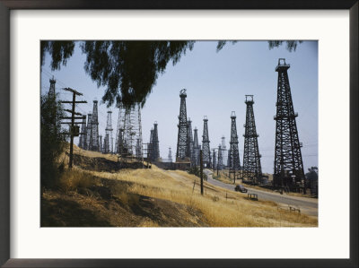 Oil Rigs Line The Road Near Long Beach by Willard Culver Pricing Limited Edition Print image
