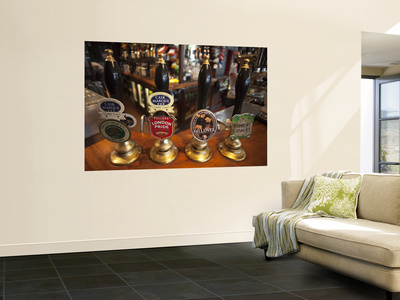 England, London, Beer Pump Handles At The Bar Inside Tradional Pub by Steve Vidler Pricing Limited Edition Print image