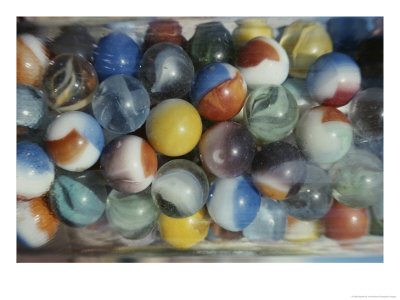 Close View Of Colorful Glass Marbles In A Jar by Stephen St. John Pricing Limited Edition Print image