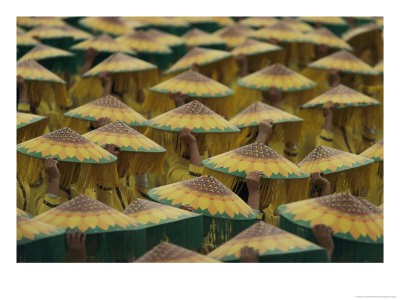 Parade Participants Cover Their Heads With Coolie Hats Painted To Look Like Sunflowers by Paul Chesley Pricing Limited Edition Print image