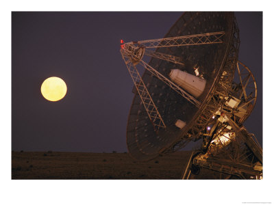 The Full Moon Rises Near A Satellite Dish by Joe Scherschel Pricing Limited Edition Print image