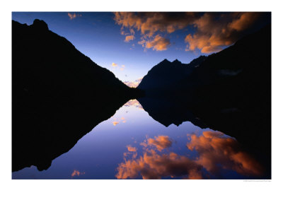 Sunset Reflecting Clouds On Upper Kintla Lake, Glacier National Park, Montana, Usa by Gareth Mccormack Pricing Limited Edition Print image