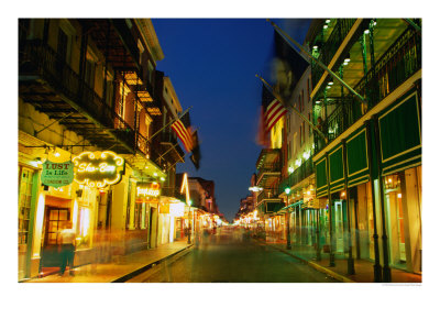 Flags Hanging Over The Empty Bourbon Street At Night, New Orleans, Louisiana, Usa by Richard Cummins Pricing Limited Edition Print image