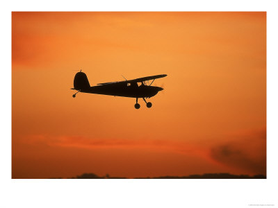 Silhouette Of Small Airplane In Flight by Kyle Krause Pricing Limited Edition Print image