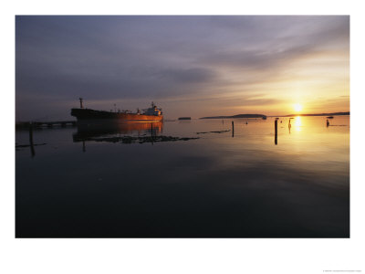 Twilight View Of A Ship At Anchor In Still Water At Low Tide by Bill Curtsinger Pricing Limited Edition Print image