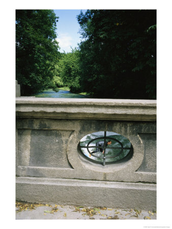 A Man Surfs On The Eisbach River In The English Garden In Munich by Taylor S. Kennedy Pricing Limited Edition Print image