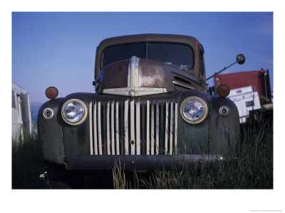 The Ruins Of A Car Sit In An Open Field, Steamboat Springs, Colorado by Taylor S. Kennedy Pricing Limited Edition Print image