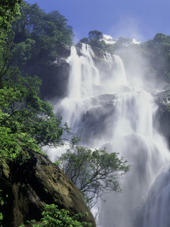 A Tall Waterfall Cascading Over Jagged Rocks by David Pluth Pricing Limited Edition Print image