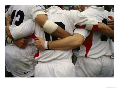 Rugby Players Huddle In A Scrum At The Annual Rugby Sevens by Eightfish Pricing Limited Edition Print image