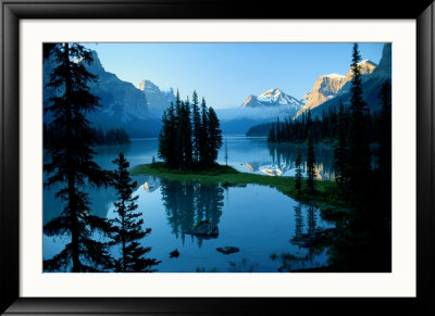 Scenic View Of The Lake Surrounded By Evergreens And Snow-Capped Mountains by Raymond Gehman Pricing Limited Edition Print image