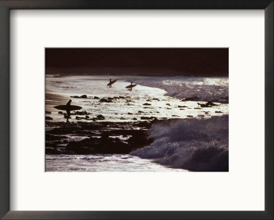 Surfers At Dawn Walking Into Waves, Cabo Blanco, Peru by Paul Kennedy Pricing Limited Edition Print image