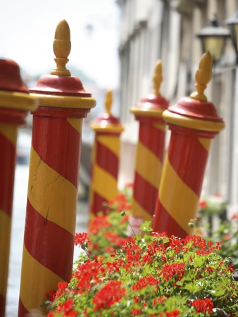 Docking Poles On Canal In Venice by Donald Nausbaum Pricing Limited Edition Print image