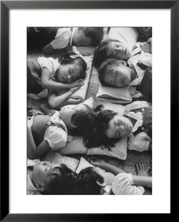 Kindergarten Students At The Yumin Chinese School Laying Head To Head During Nap Time by Howard Sochurek Pricing Limited Edition Print image
