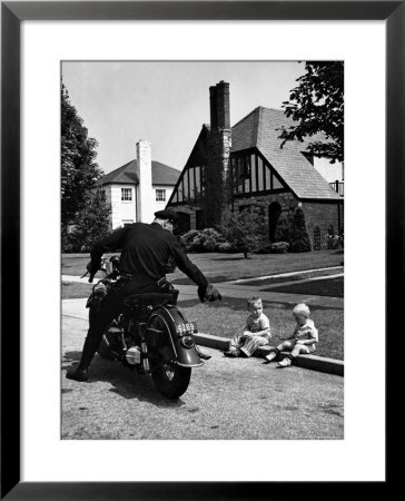 Policeman On Motorcycle Chatting With Toddler Boys Sitting On Curb by Alfred Eisenstaedt Pricing Limited Edition Print image