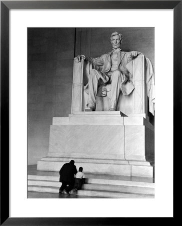 Black Man And Small Boy Kneeling Prayerfully On Steps On Front Of Statue In The Lincoln Memorial by Thomas D. Mcavoy Pricing Limited Edition Print image